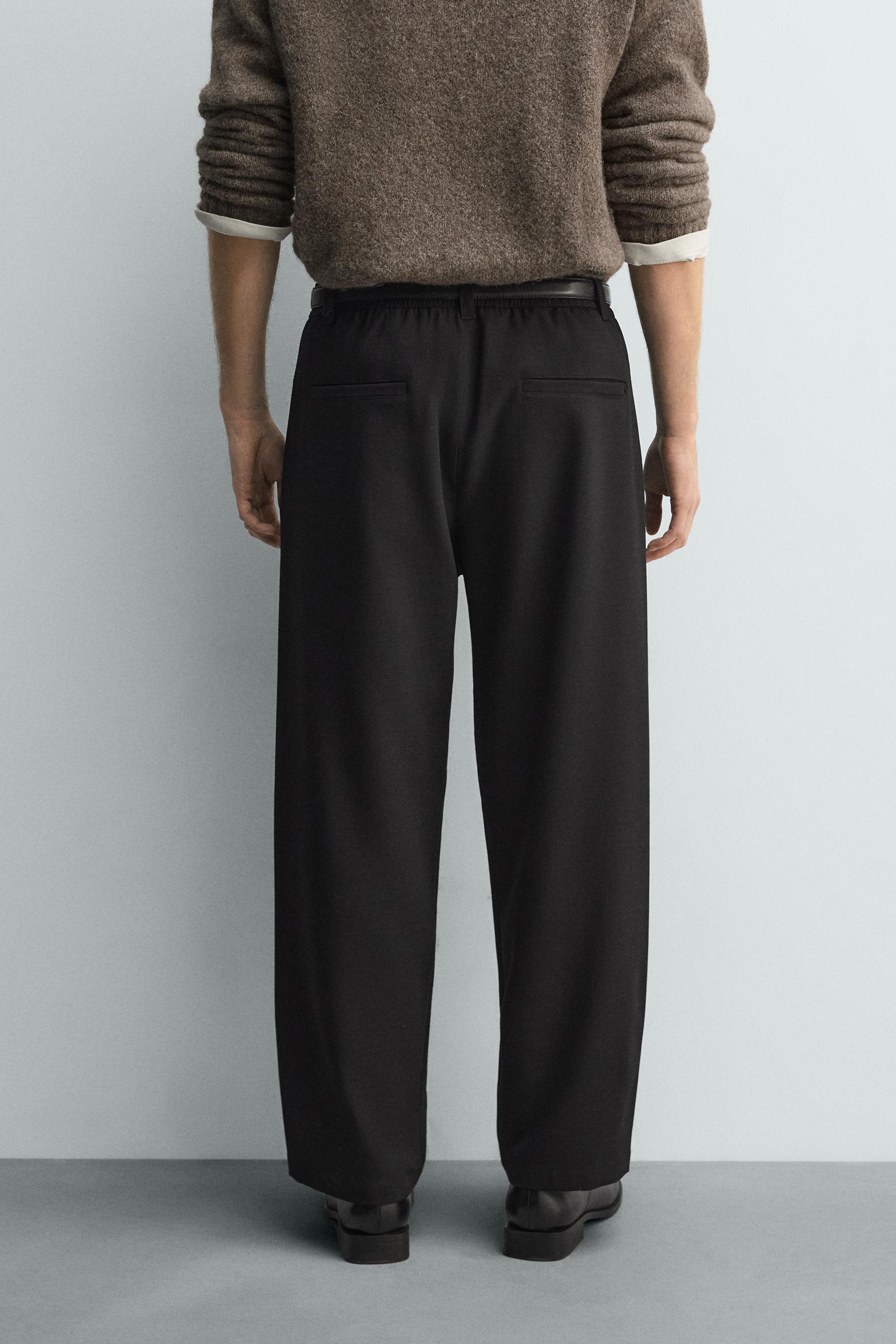 RELAXED FIT PLEATED PANTS